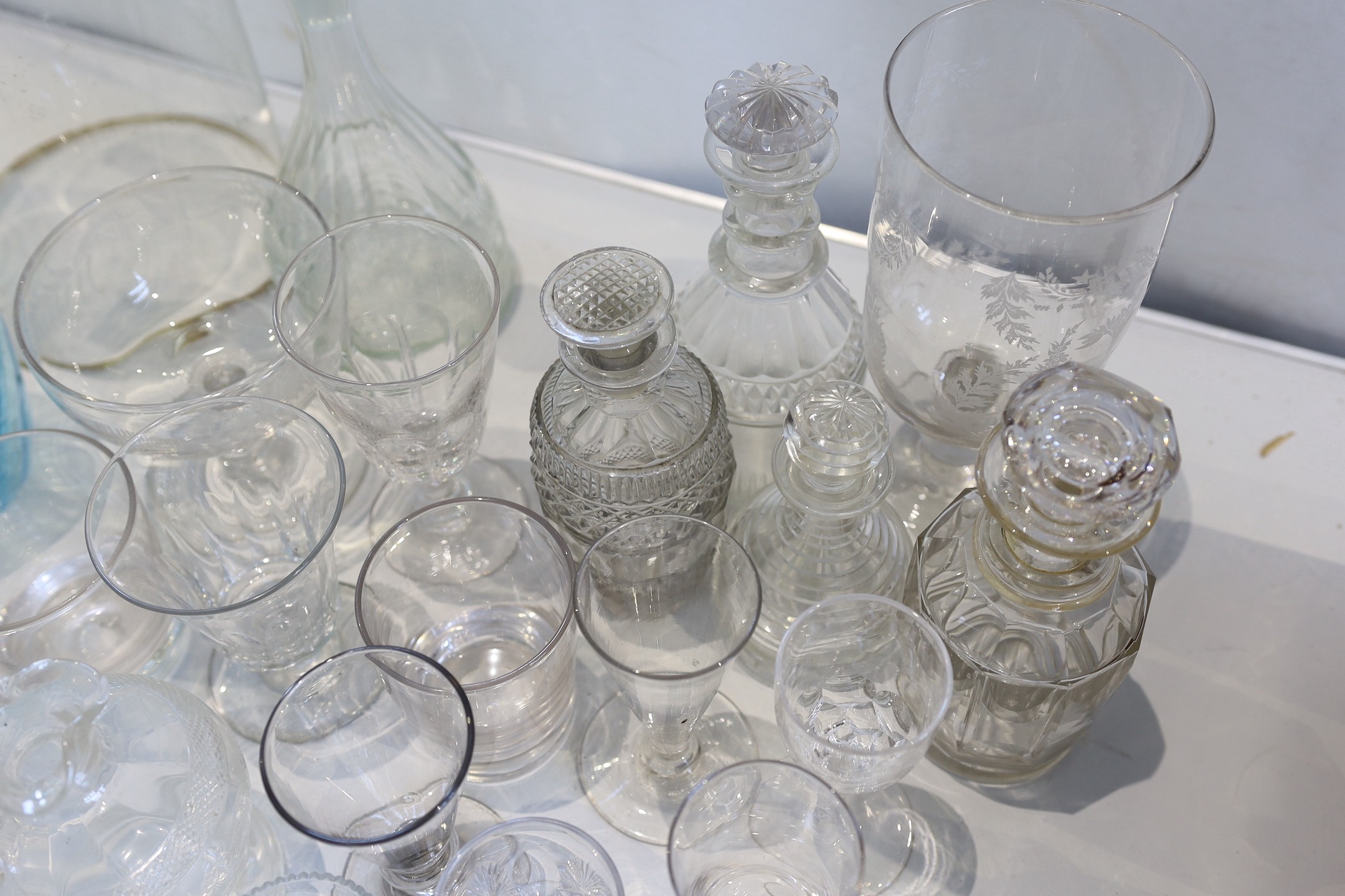 A collection of 19th century and later decanters, drinking glasses, oil bottles etc.